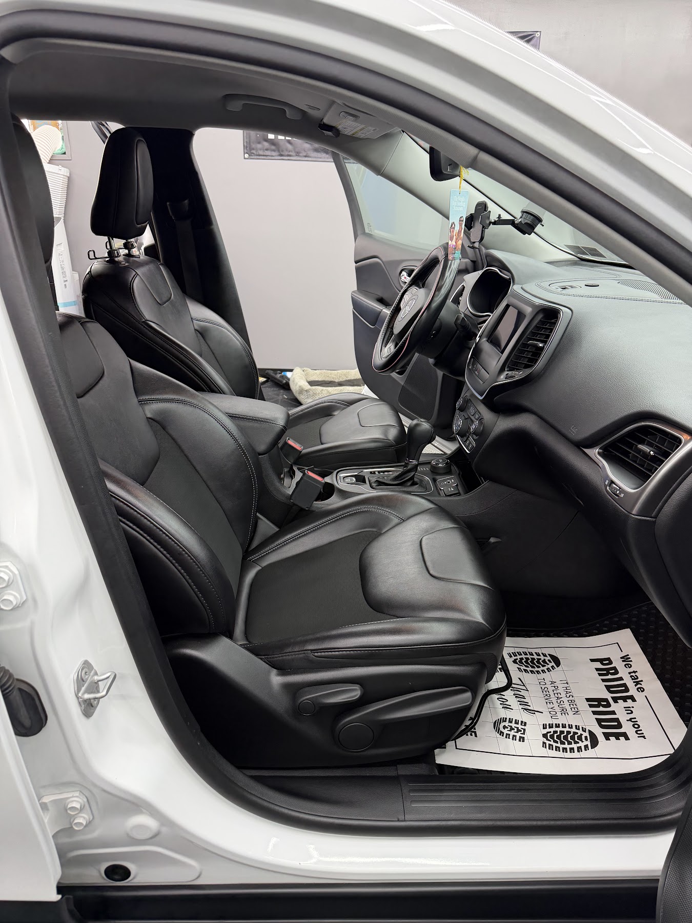 Detailed black leather interior of a JP Sudz customer vehicle